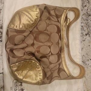Coach Ergo Signature Logo Jacquard Hobo Bag in tan and gold.